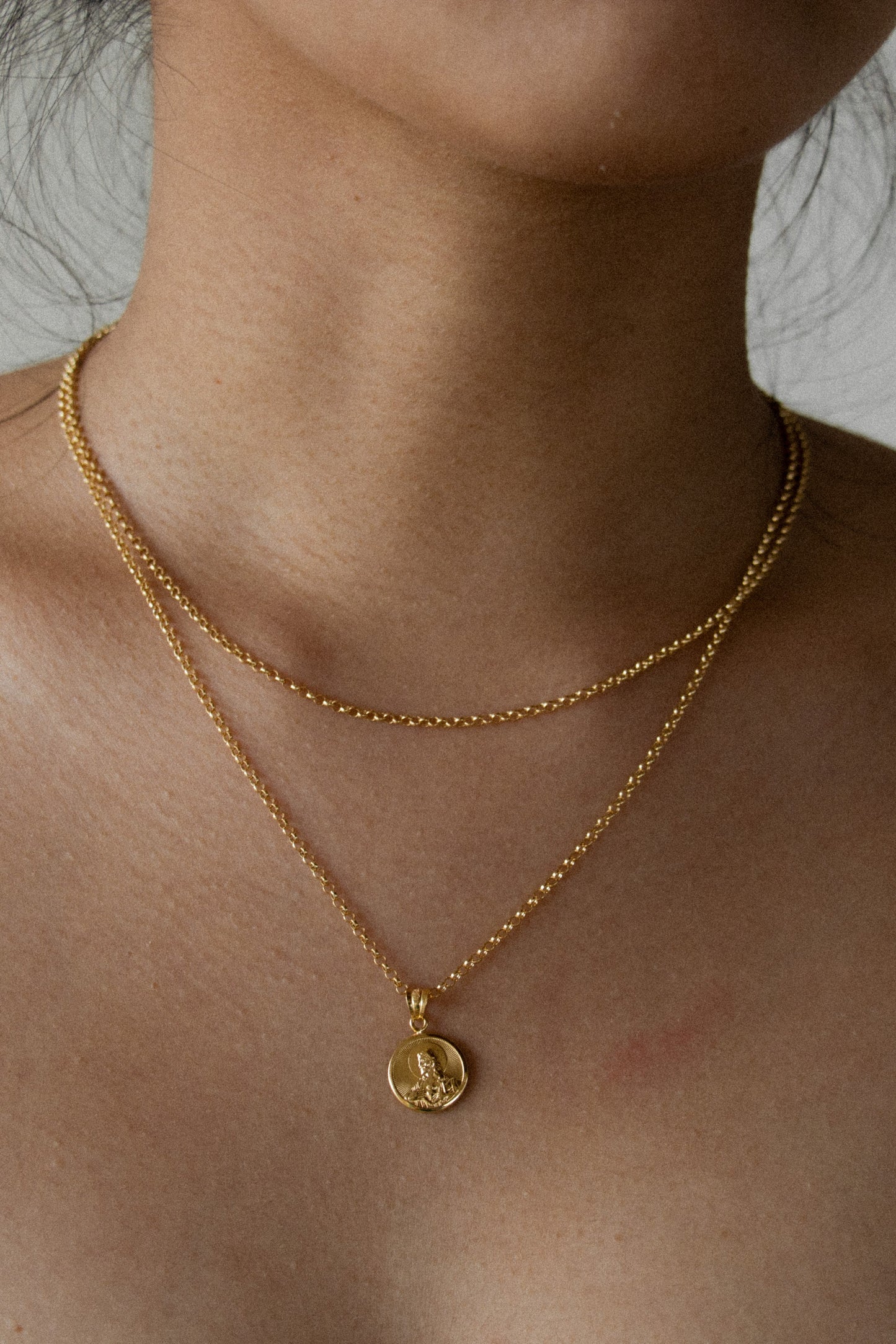 Saudi gold necklace with a sacred heart pendant and rollo chain layered. fine jewelry in the philippines